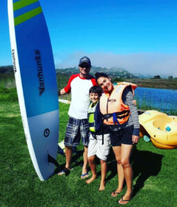 Darren, Logan and Talitha paddle boarding